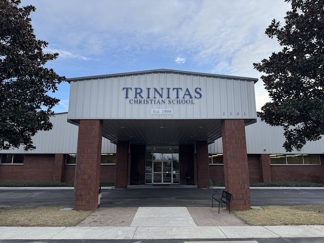 Trinitas Christian School building in Pensacola with school name on the facade.