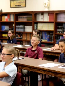 Trinitas students smiling together on campus
